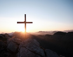 wooden cross sunset